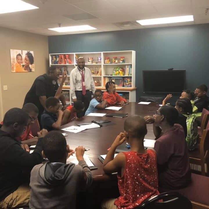 Mentors from 100 Black Men of Central Illinois educated young boys