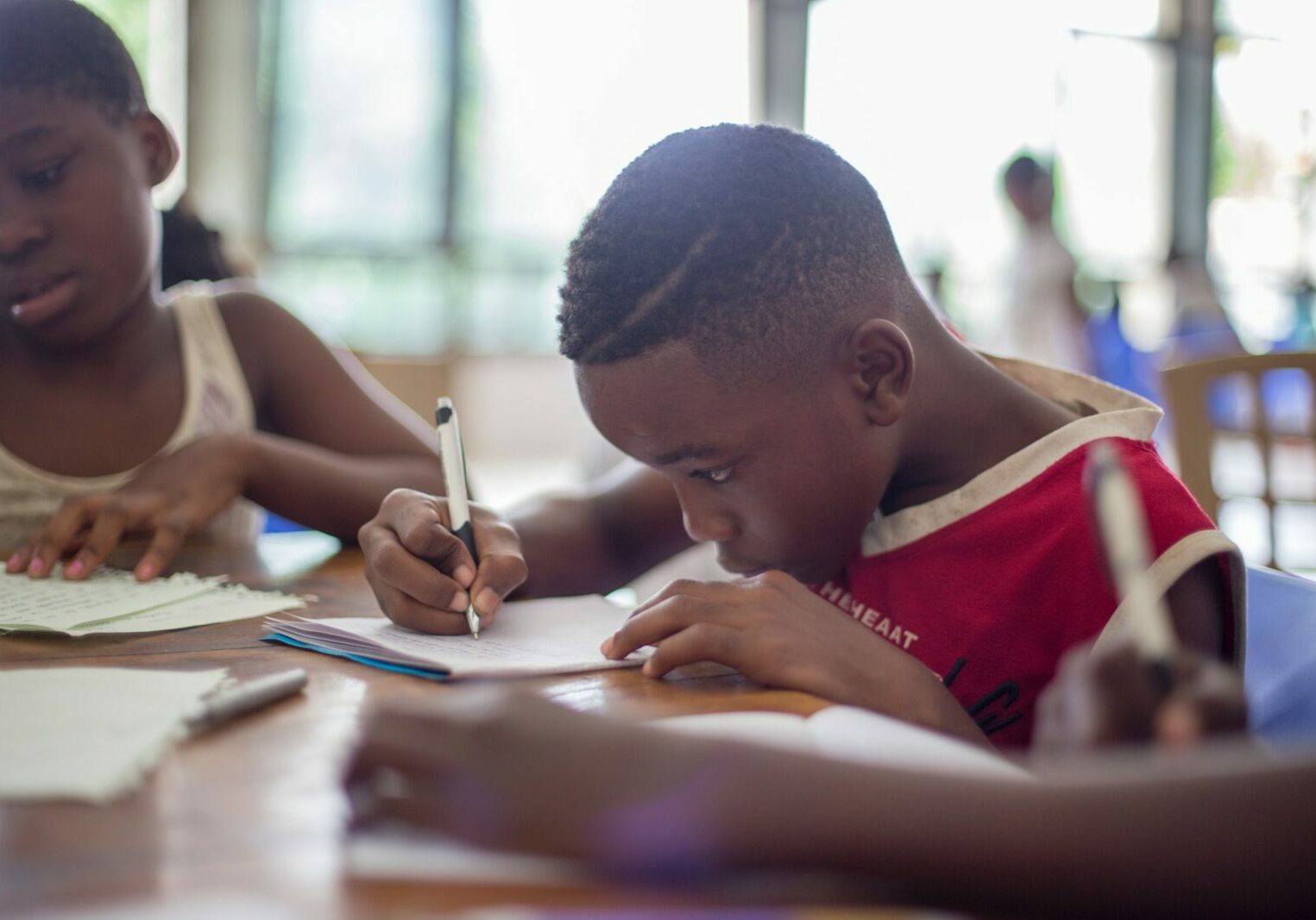 A young black boy receives mentorship through 100 Black Men of central Illin